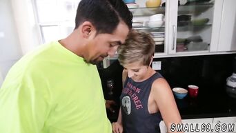 The tiny girl sucks a huge dick in the kitchen